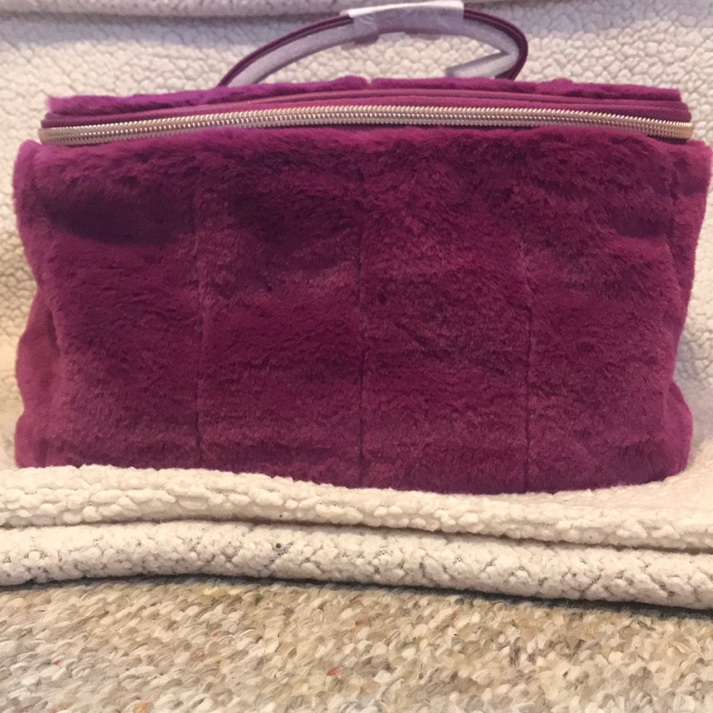 A Purple makeup bag or a small travel bag 💜💜